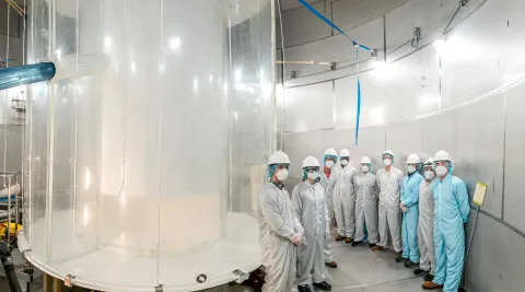 Members of the LZ team in the LZ water tank after the outer detector installation.