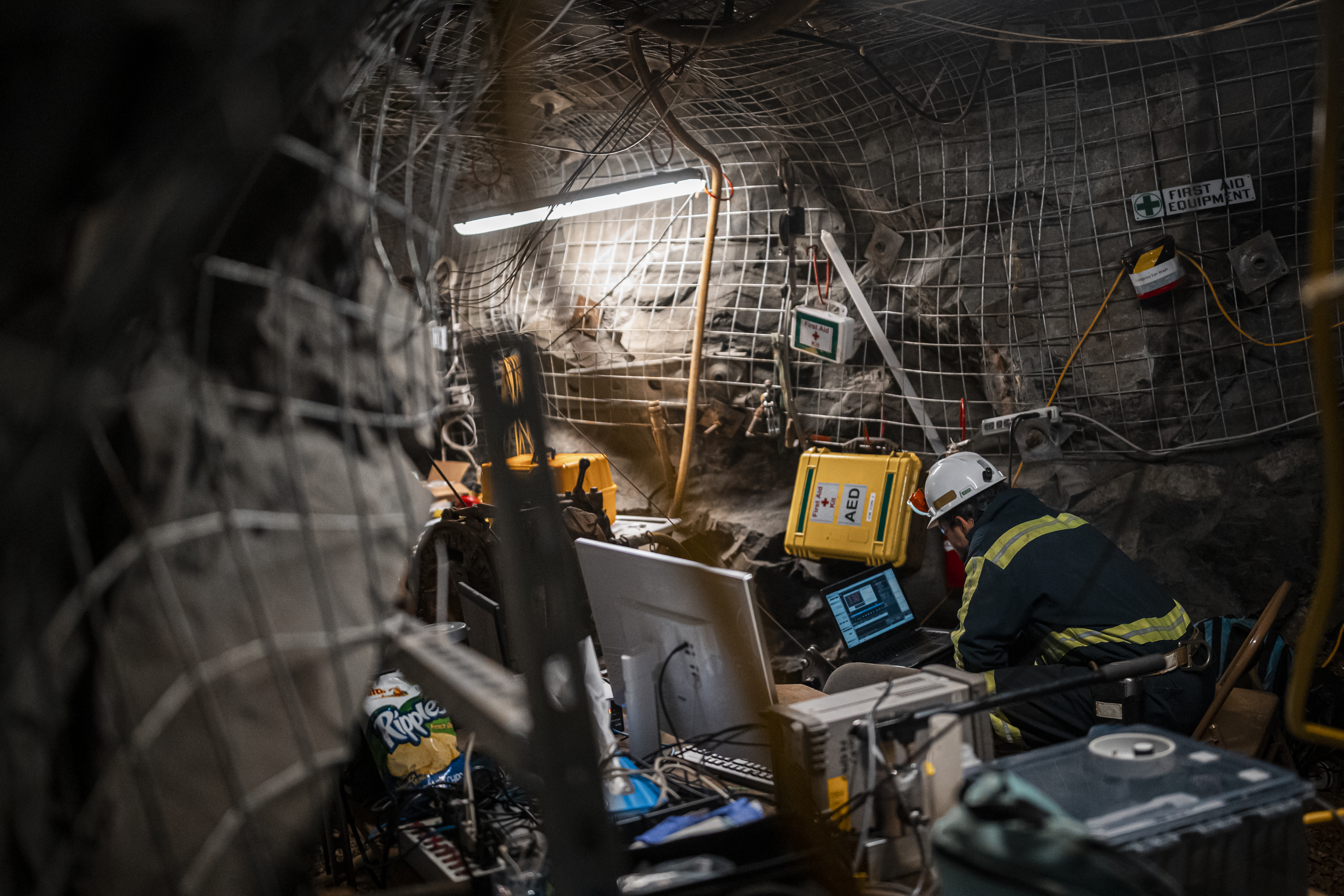 Researcher and equipment in an underground drift