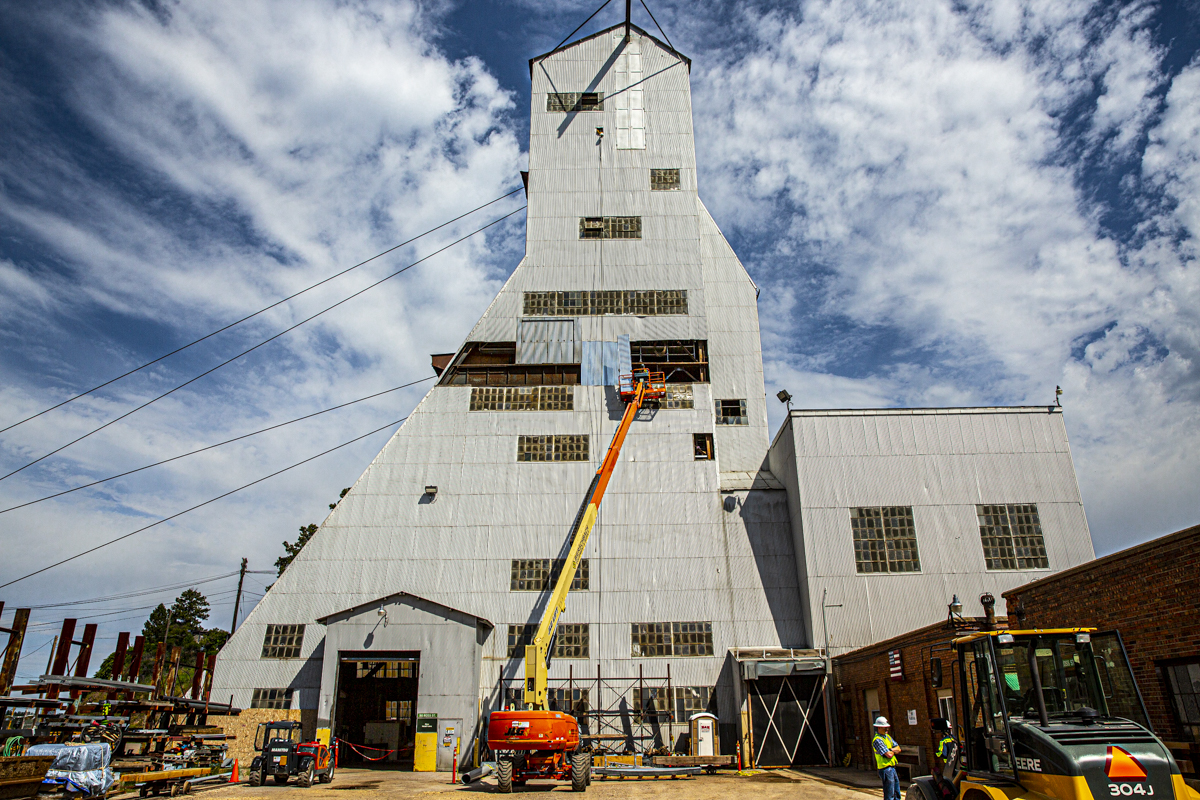 Crews replace paneling on the shell of the Ross Headframe.