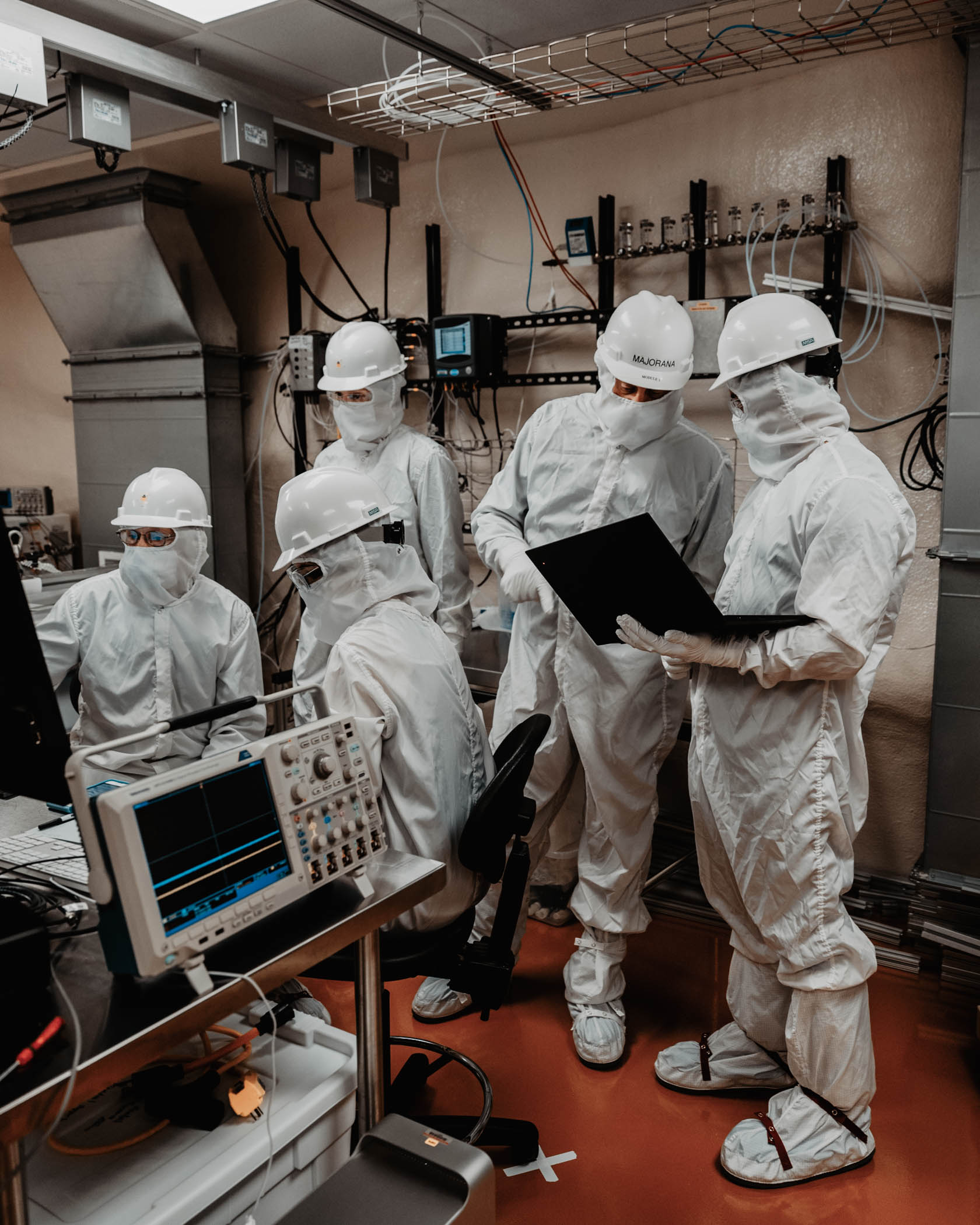 researchers in Tyvek suits take data