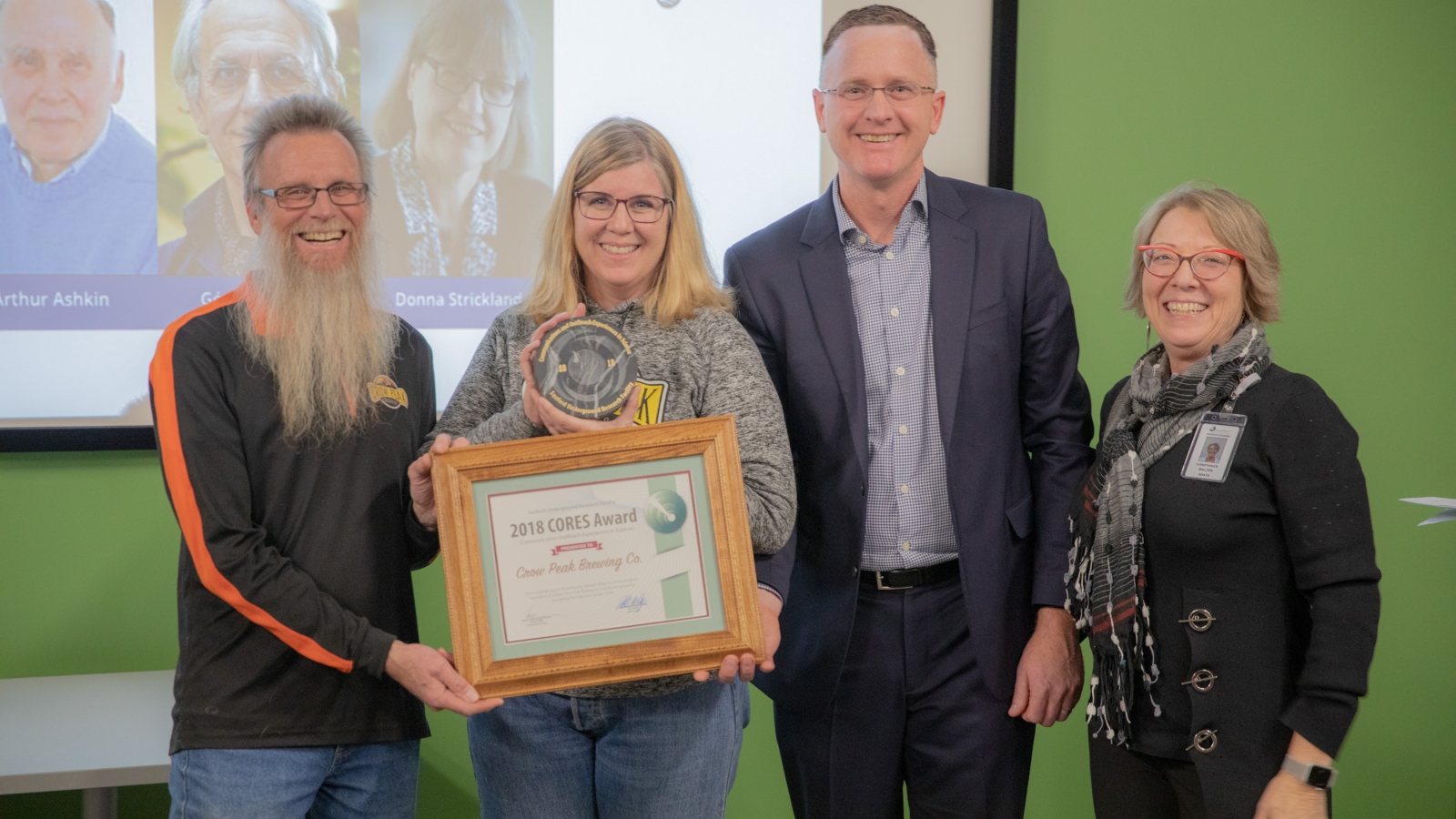 The first CORES award presented to Crow Peak Brewing Co. Pictured left to right are Crow Peak Brewing Co. owners Jeff Drumm and Carolyn Ferrel, SURF Executive Director Mike Headley and Communication Director Constance Walter.