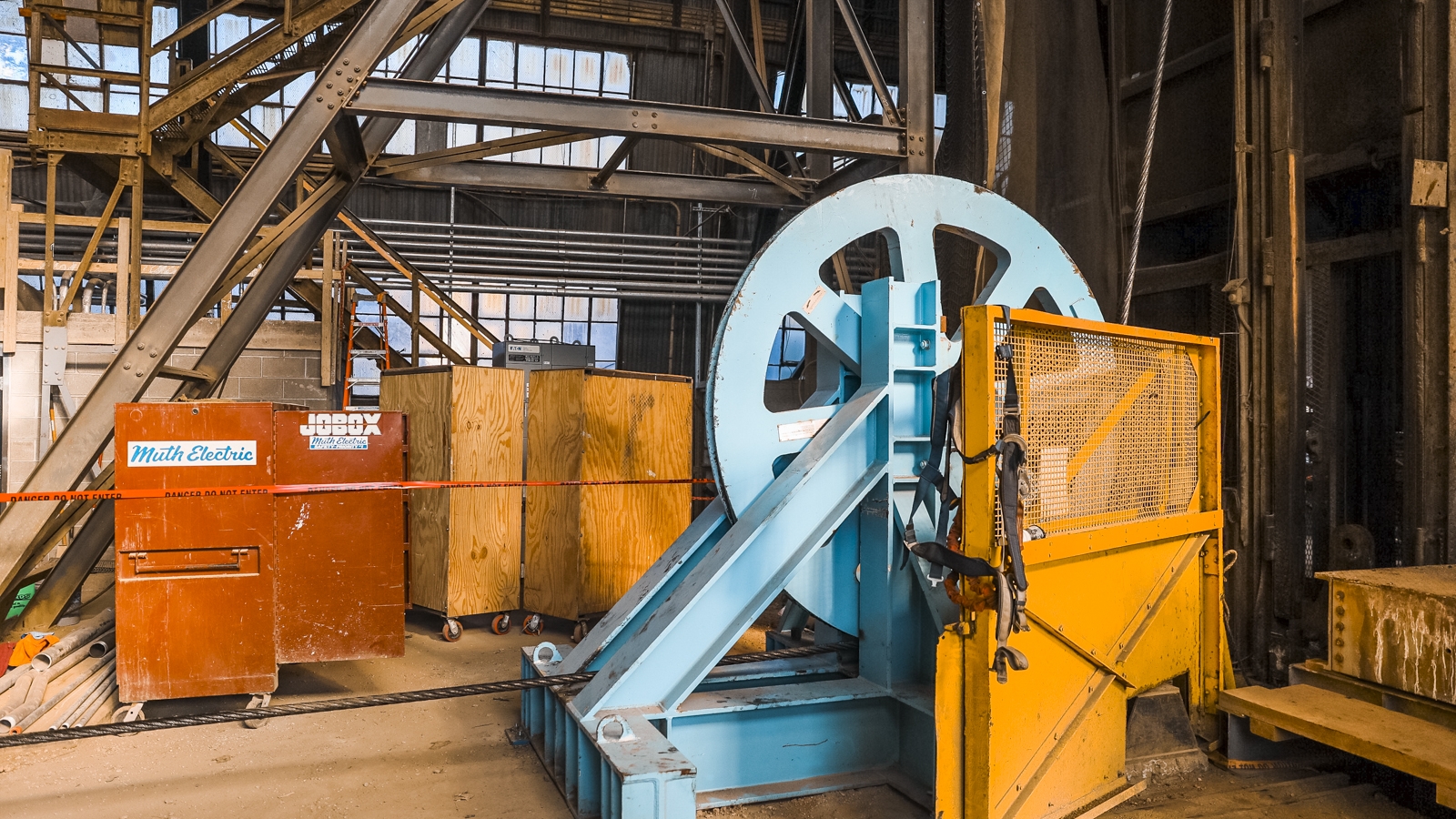 A wheel spins as thick steel cables are replaces in the Ross Shaft. 