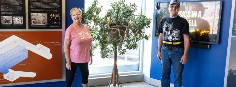 Donald Daywitt, and Laurie Adkins-Heydon pose near a jade tree they cared for during their careers at hoist operators. 