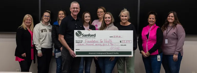 SDSTA Staff present a check to the Foundation for Health for the 2023 Breast Cancer Awarness Month Fundraiser