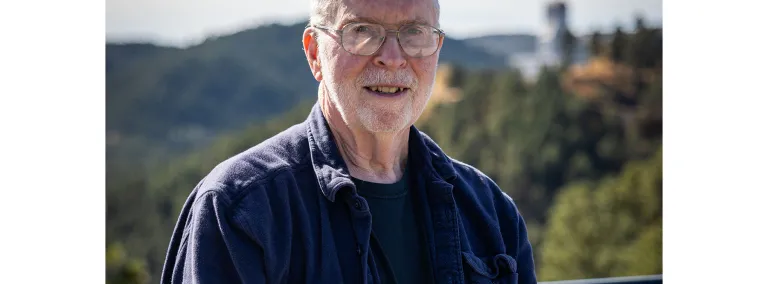 A photo of Gil Gilchriese standing outside at SURF. 