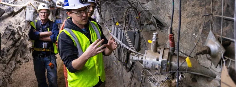 Dr. Chet Hopp, with LBNL, is one of many researchers involved in CUSSP points to one of the monitoring boreholes used in the experiment