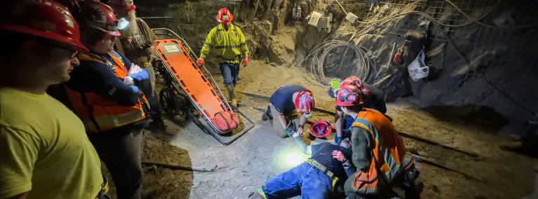 Stephen Kenny captured this photo of a ERT training session inside the 800 Level of SURF - this image shows technicians around a person who is pretending to be injured in an underground space. 