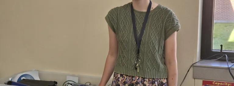 Emily Siemonsma in a classroom with scientific equipment