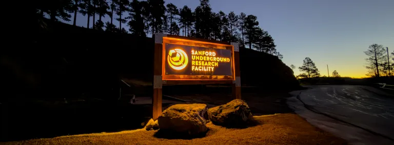The glowing sign at the Yates Gate during the first light of the morning sun. 