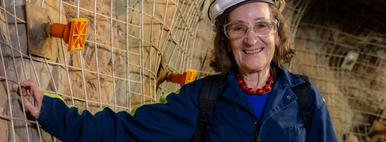 Dr. Neta Bahcall, the Eugene Higgins Professor of Astrophysics at Princeton University shown here underground on the 4850 Level of SURF. 
