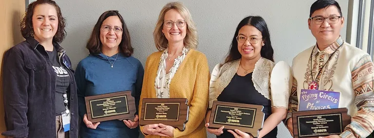The 2026 Outstanding STEM education teachers in South Dakota holding their awards in a group photo