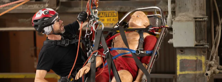 William Buckman from NIM Medical completing a mock rope rescue at SURF.