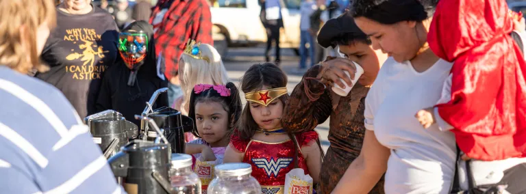 Dark Matter Day / Halloween Trunk or treat at SURF with children and families trick-ro-treating in costume 