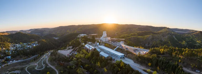 SURF aerial shot showing the Yates complex in the sunrise on a fall morning with yellow trees
