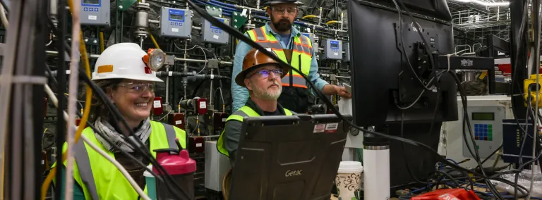 Dr. Hunter Knox, an Earth scientist at PNNL (left),  works with Vince Vermeul,  an environmental engineer at PNNL (seated), and Dr. Jeff Burghardt, an Earth scientist at PNNL, at 4100 feet below the surface on the EGS Collab experiment, which set the stage for CUUSP at SURF.  