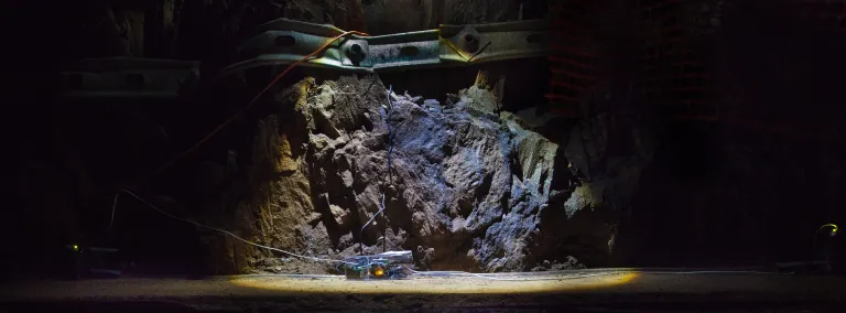 A tilt meter dramatically lit underground.