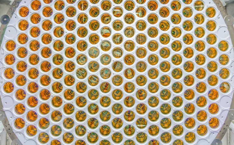 A much larger PMT arrays in LZ than in LUX. This image shows many more shiny photomultipler tubes than in LUX.