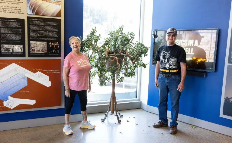 Donald Daywitt, and Laurie Adkins-Heydon pose near a jade tree they cared for during their careers at hoist operators. 