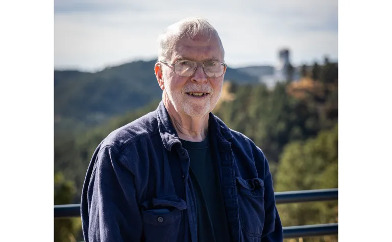 A photo of Gil Gilchriese standing outside at SURF. 