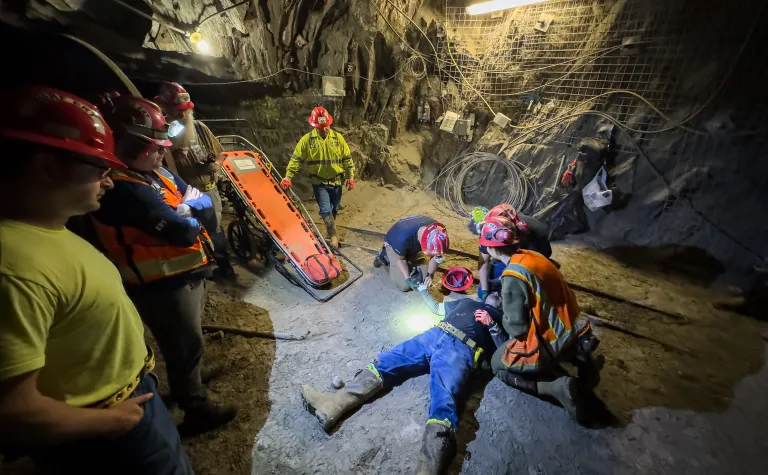 Stephen Kenny captured this photo of a ERT training session inside the 800 Level of SURF - this image shows technicians around a person who is pretending to be injured in an underground space. 