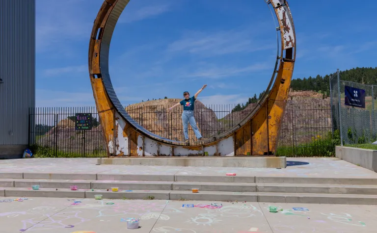 A person stands inside the Davis Ring during Neutrino Day 2025 