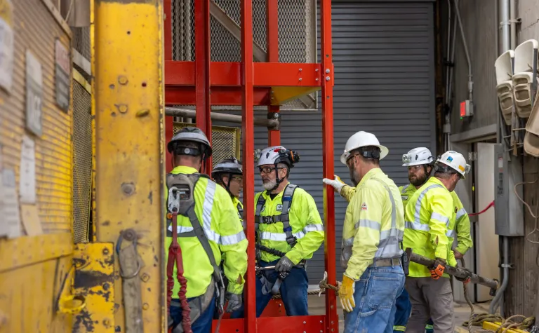 Crews installing the Ross Skip Cage into the shaft at SURF. 