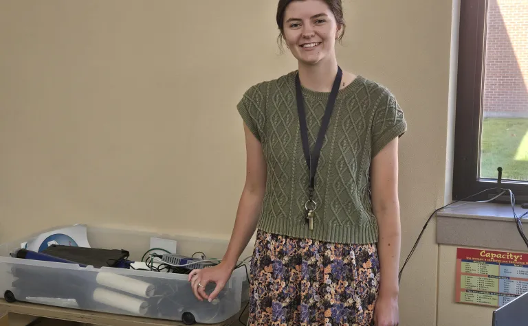 Emily Siemonsma in a classroom with scientific equipment
