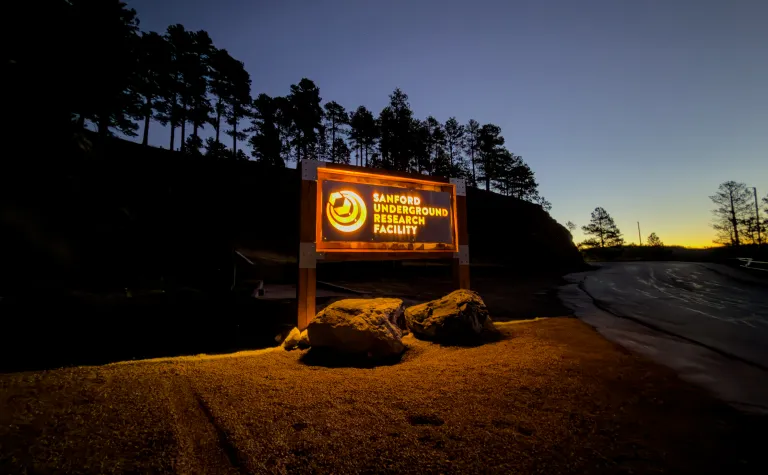 The glowing sign at the Yates Gate during the first light of the morning sun. 