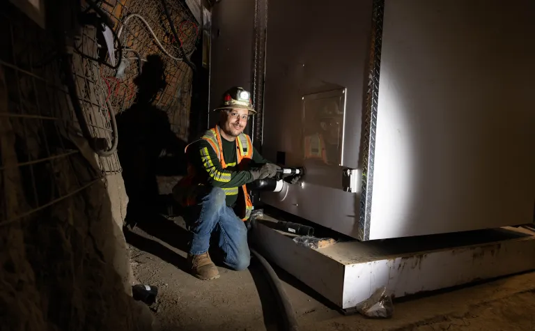 Nate Sanchez a plumbing contractor with Harrison Western working to install a bathroom pod on the 4850 Level of SURF. 