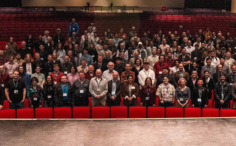 Members of the DUNE Collaboration gathered inside a theater during the 2026 meeting in Rapid City 