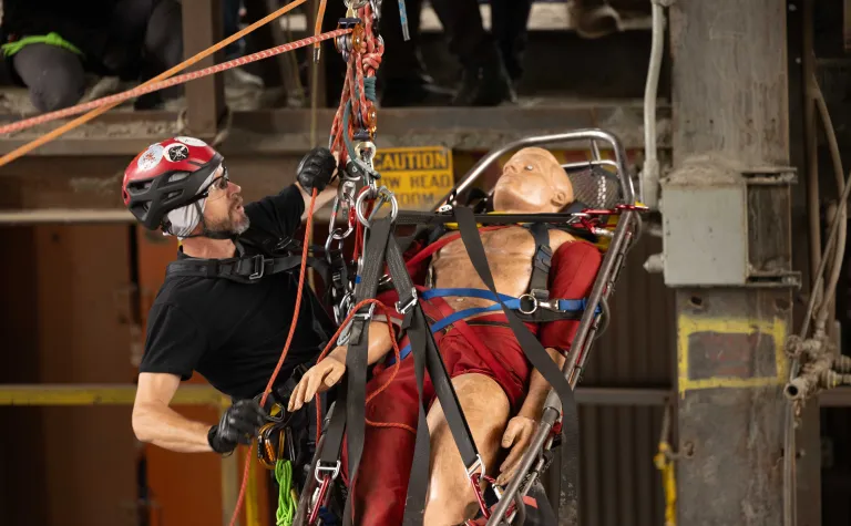 William Buckman from NIM Medical completing a mock rope rescue at SURF.