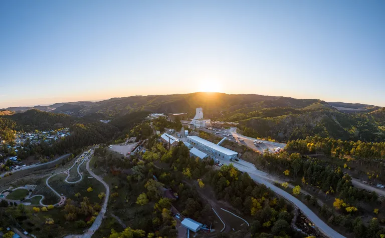 SURF aerial shot showing the Yates complex in the sunrise on a fall morning with yellow trees