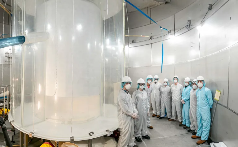 Members of the LZ team in the LZ water tank after the outer detector installation.