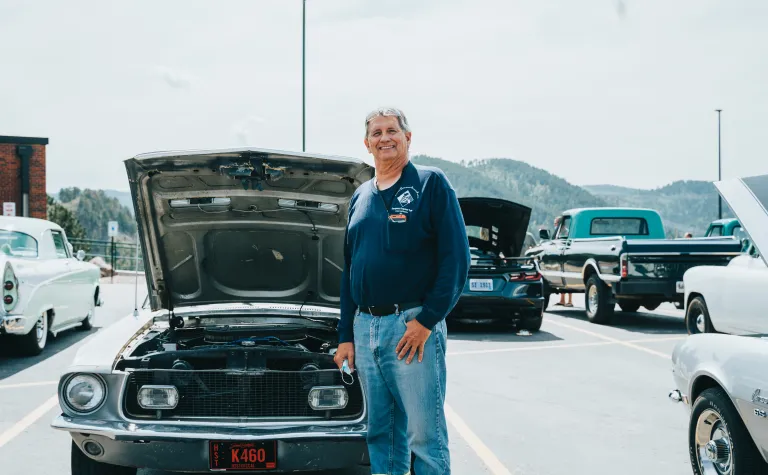 Jackson Pahl stands beside his 1968 Mustang California Special
