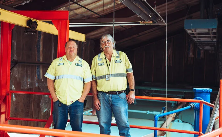 Pat Hasson and Ken Noren stand in the WWTP