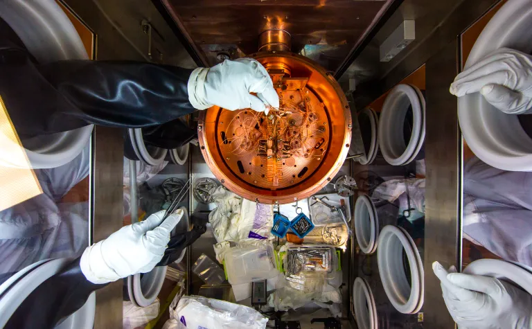 Researchers work on the inner Majorana Demonstrator cryostat, which is in a glovebox