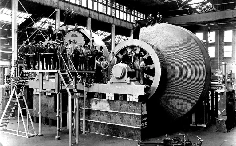 black and white photo of hoists with engineers and workers in the Nordberg Manufacturers plant