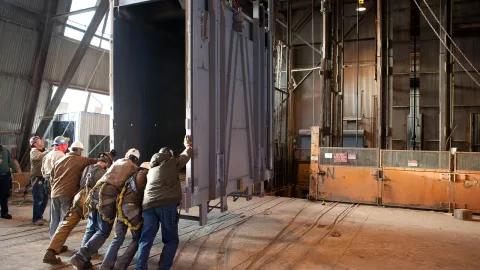 Building a new cage to take scientists underground.