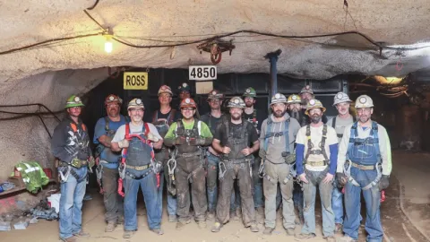 group of men standing at the 4850 ross station