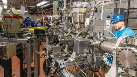 scientist working with a metal object
