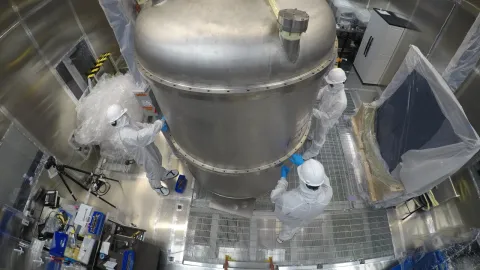 people in clean suits working around lz detector