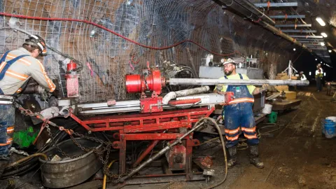 men working with underground drilling tools