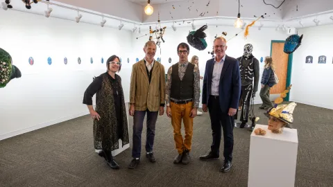 artists kahn and selesnick stnading at their exhibit