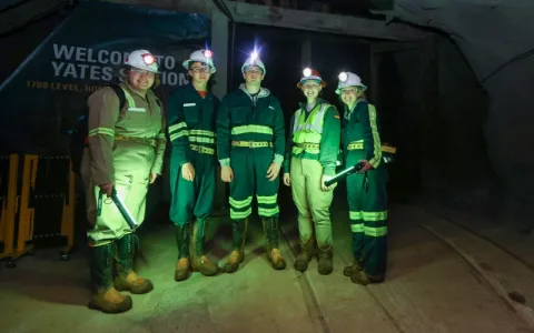 group of young interns standing at the 1700 foot level yates station