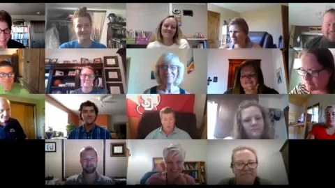 group of people's faces on a zoom call