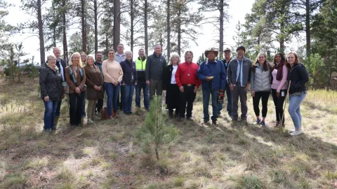 group of people standing on the sacred circle garden site