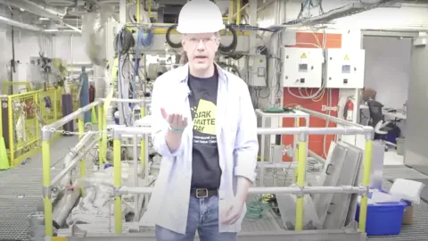 scientist wearing hard hat underground 