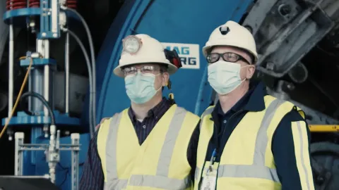 2 men wearing masks