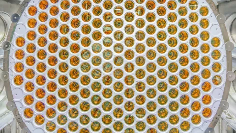 A much larger PMT arrays in LZ than in LUX. This image shows many more shiny photomultipler tubes than in LUX.
