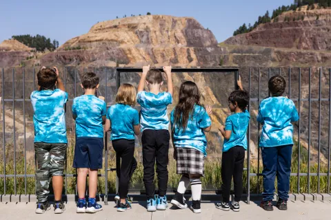 A group of second graders look over the Open Cut at the Sanford Underground Research Facility visitor center in Lead.